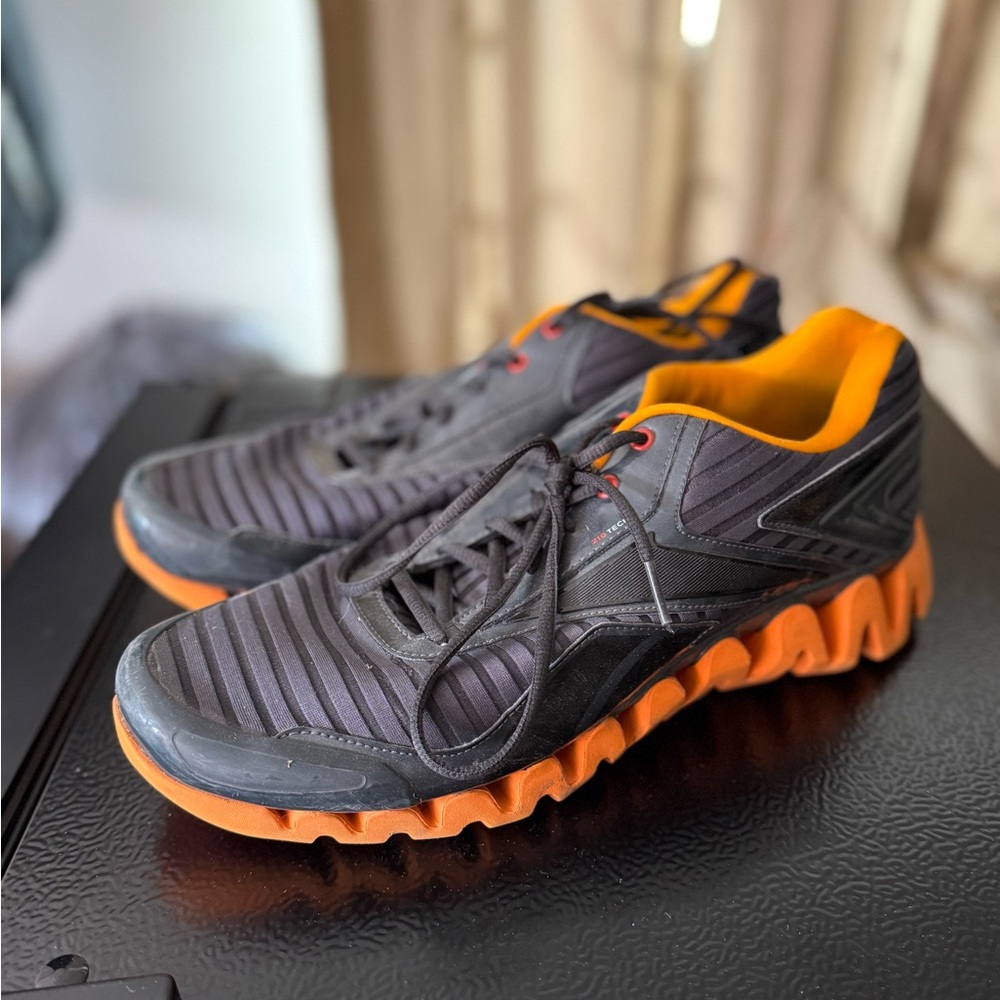 Reebok Black and Orange Zigtech Sneakers